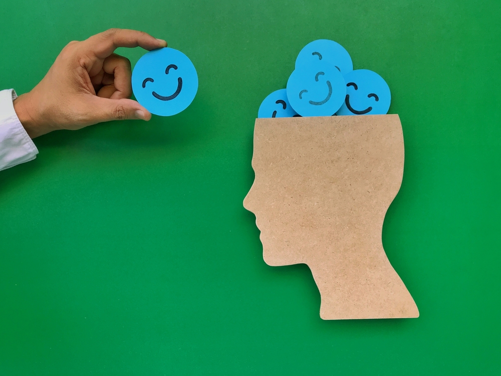 Hands,Adding,Smile,Symbols,To,People's,Head,Symbols.,On,A