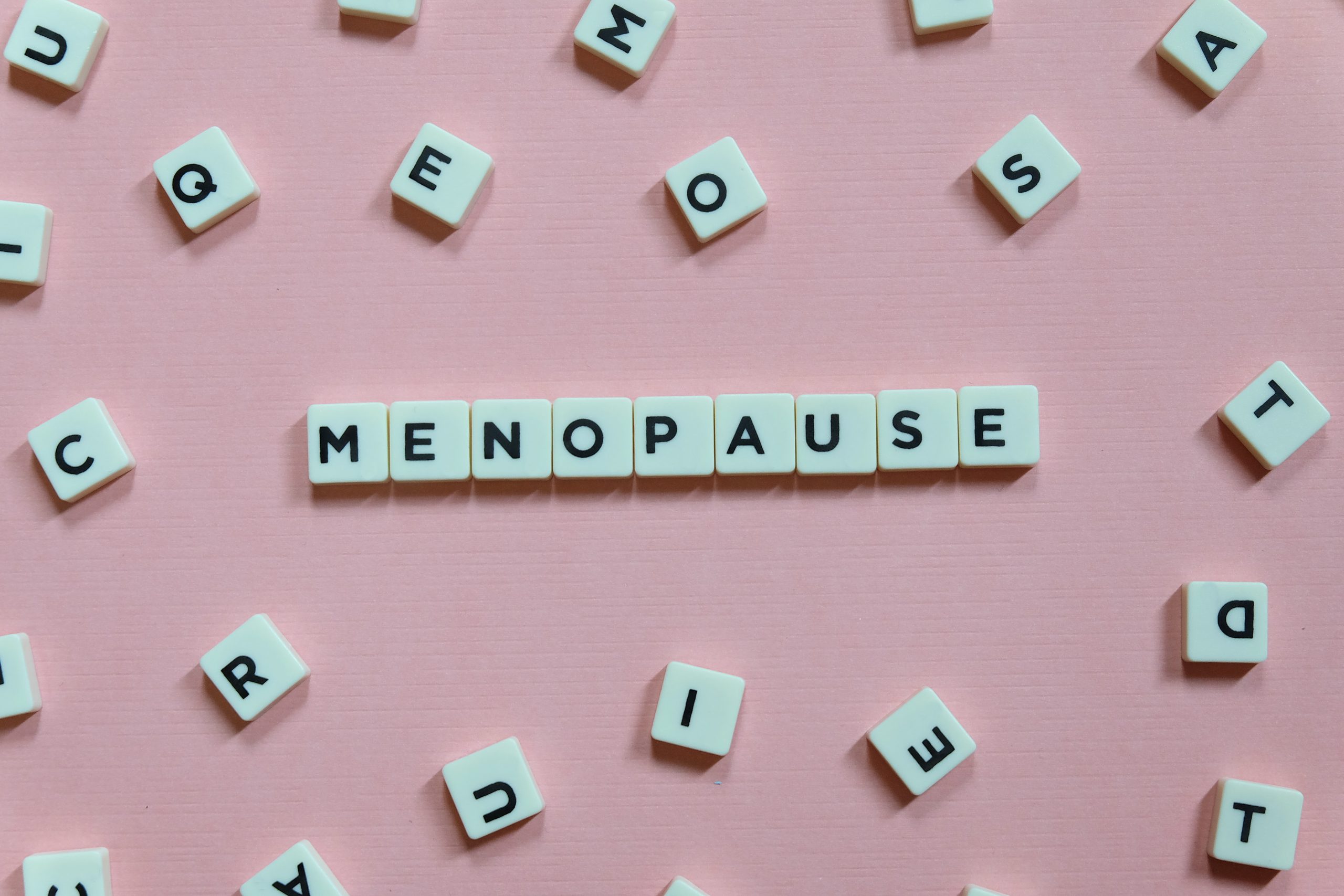 Menopause,Word,Made,Of,Square,Letter,Word,On,Pink,Background.