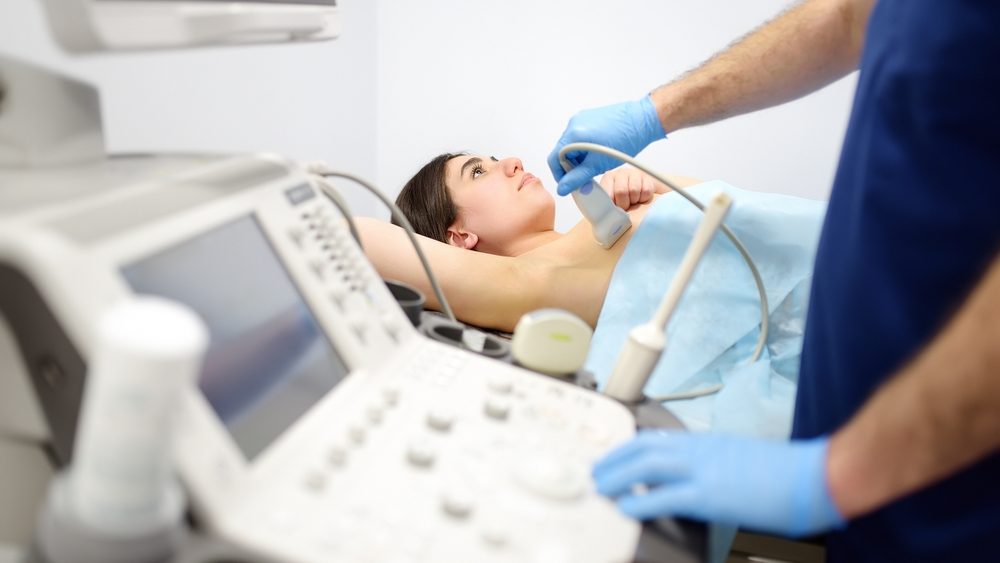 Mammologist,Doctor,Examines,A,Woman,Breasts,And,Lymph,Nodes,Using