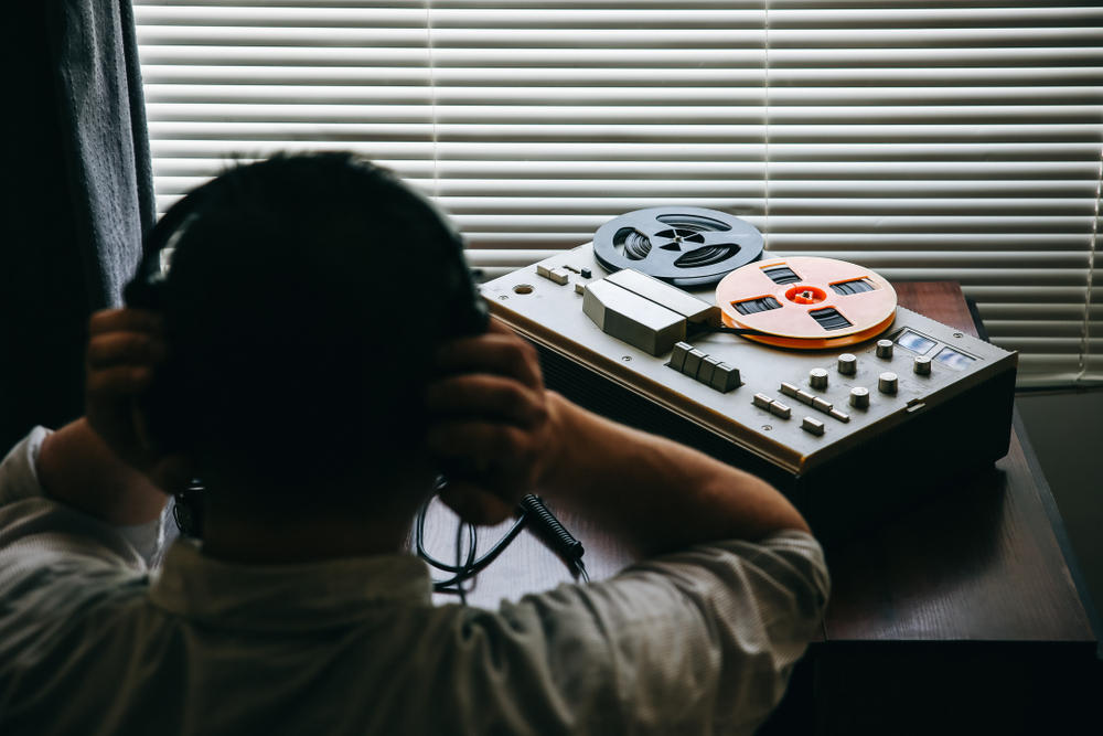 Special,Agent,Listens,On,The,Reel,Tape,Recorder.,Officer,Wiretapping