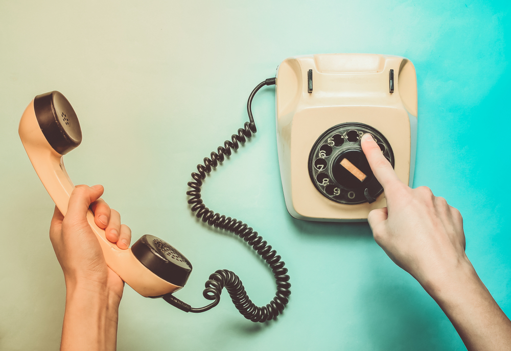 Woman,Hands,Picks,Up,The,Number,Of,The,Rotary,Phone