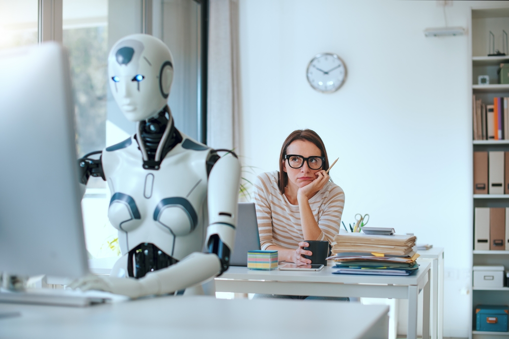 Disappointed,Stressed,Woman,And,Ai,Robot,Sitting,At,The,Office