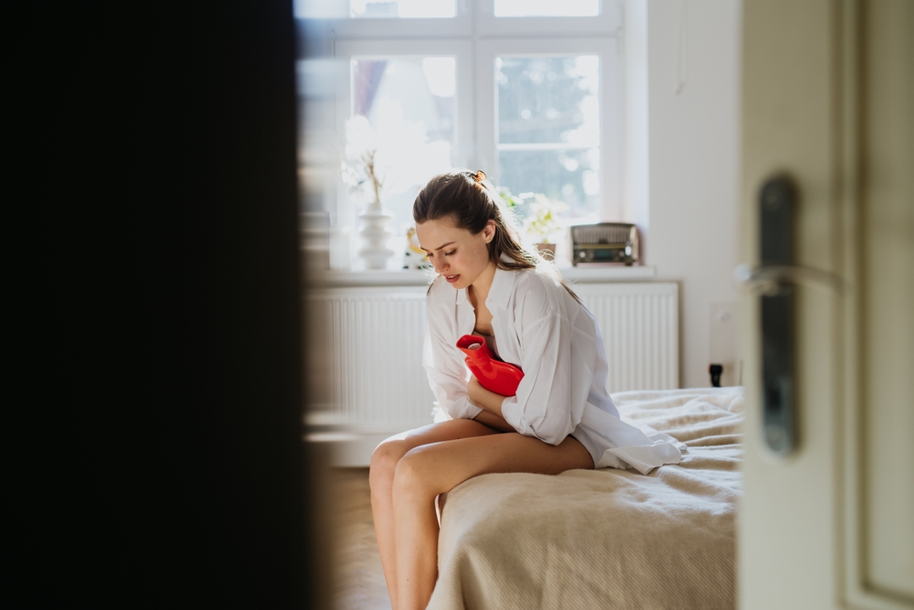 Woman,At,Home,Suffering,From,Menstrual,Pain,,Having,Cramps.,Woman