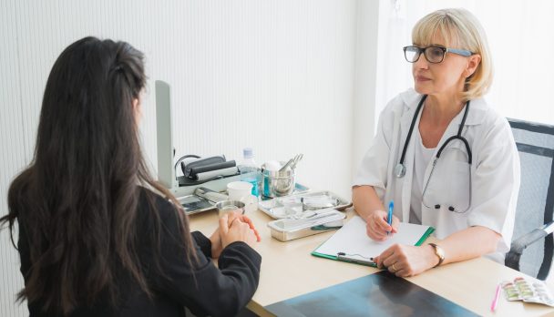 Senior,Female,Doctor,Meet,The,Patient,Discussing,And,Making,Notes