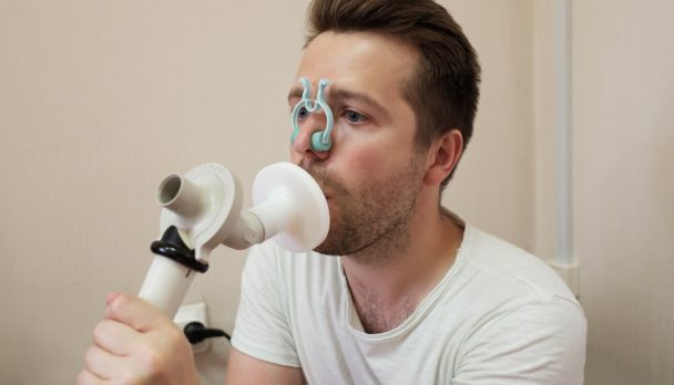 Young,Man,Testing,Breathing,Function,By,Spirometry,Having,Health,Problem.