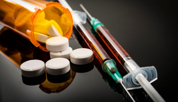 Opioid,Epidemic,,Drug,Abuse,Concept,With,Closeup,On,Two,Heroin