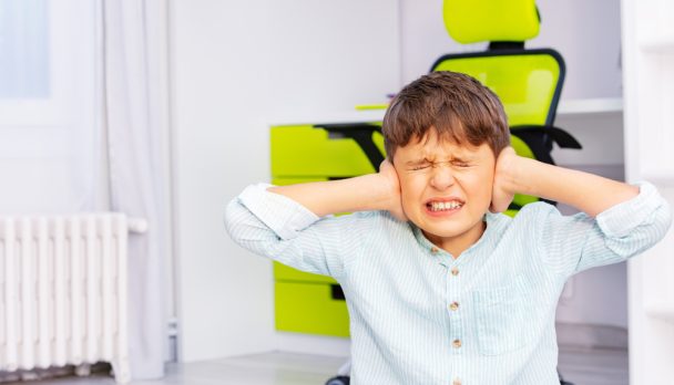Autistic,School,Age,Boy,With,Strong,Negative,Face,Expression,Closing