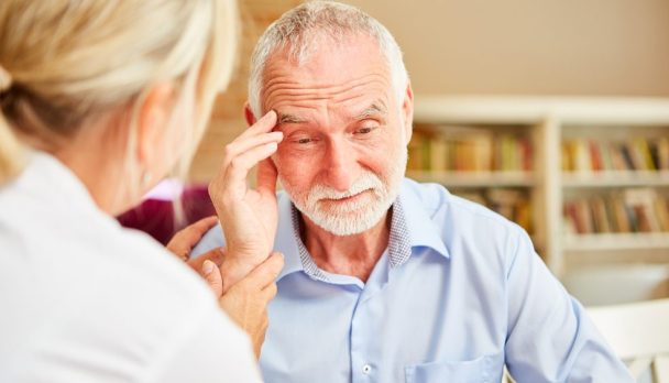 Senior,With,Dementia,Or,Alzheimer's,Is,Comforted,By,Caring,Female