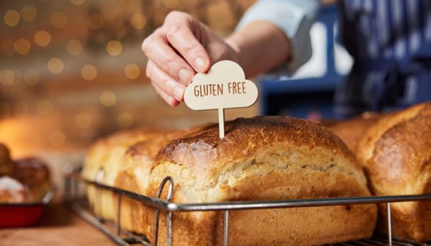 Sales,Assistant,In,Bakery,Putting,Gluten,Free,Label,Into,Freshly