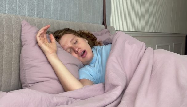 Young,Woman,Sleeps,In,The,Bedroom,During,The,Day,And