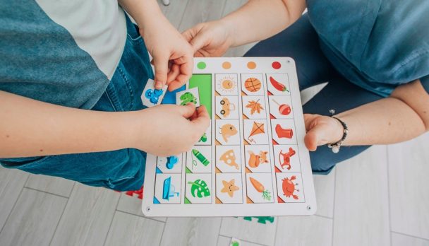 Child,Engaging,In,Color-matching,On,Educational,Board,In,Structured,Learning