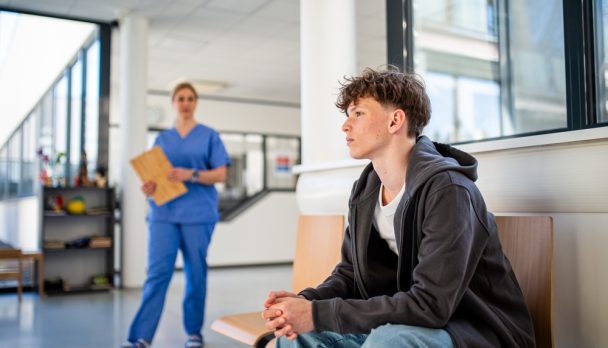 Teenage,Boy,Waiting,Alone,In,Hospital,Waiting,Area,Before,Medical