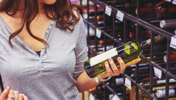 Woman buying alcohol